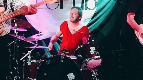 Photograph of Gene drumming on stage in Newport recently