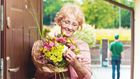 Woman receives flowers