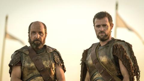 The picture shows Agamemnon (Johnny Harris) and Menelaus (Jonas Armstrong) in Troy: Fall of a City