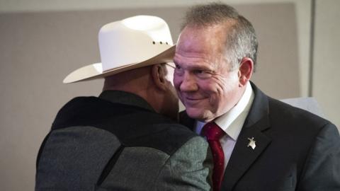 Roy Moore with supporter
