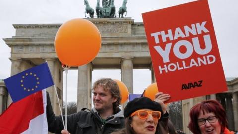 Demonstrators in Germany welcome the result of the Dutch election, 16 March 2017