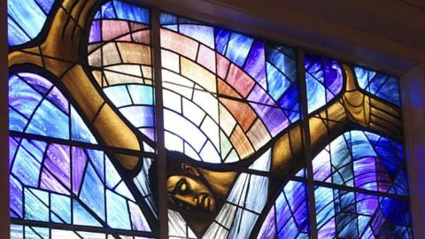 The stained glass window depicting a black Jesus