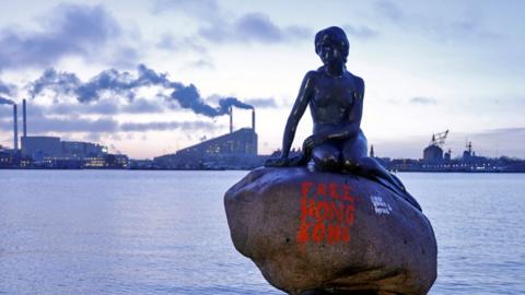 Little Mermaid statue with 'Free Hong Kong' graffiti