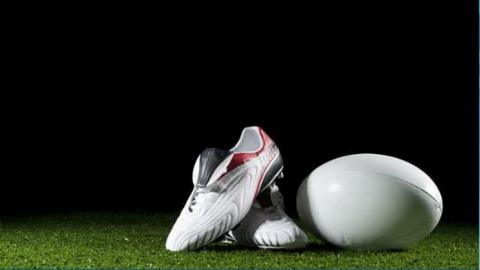 Rugby league ball and boots