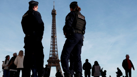 French police stand near the Eiffel Tower in Paris