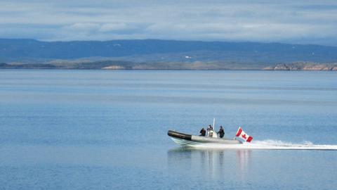 A Canadian Navy Zodiac on patrol across the Arctic Ocean near Baffin Island in 2007