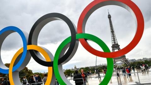Olympic rings in front of Eiffel Tower