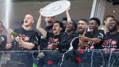 Bayer Leverkusen players celebrate winning the Bundesliga