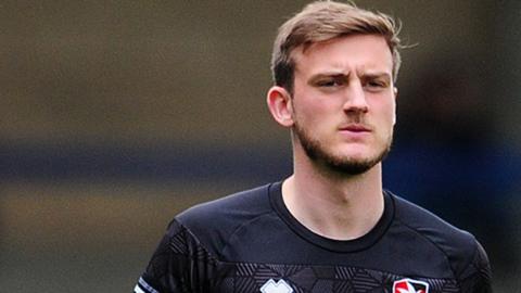 Charlie Brown warming up during his spell with Cheltenham Town