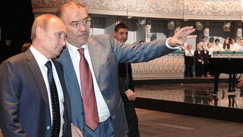 Russian President Vladimir Putin (L) listens to Valery Gergiev at the Mariinsky Theatre Valery Gergiev in 2013