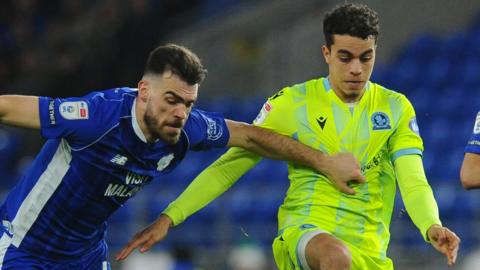 Blackburn Rovers' Yasin Ayari (right) battles with Cardiff City's Dimitrios Goutas