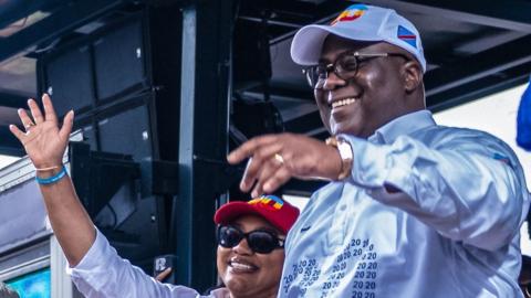 The President of the Democratic Republic of Congo Felix Tshisekedi, (R), waves to supporters during a campaign rally in Kinshasa, Democratic Republic of Congo, 18 December 2023.