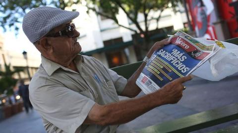 Man reads a newspaper in Puerto Rico