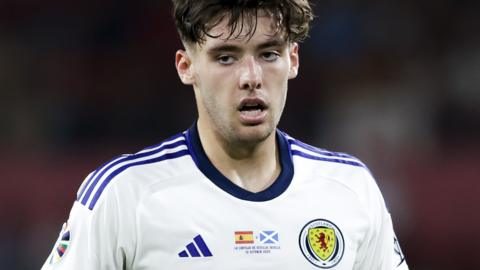 Aaron Hickey playing for Scotland