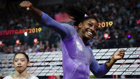 US gymnast Simone Biles celebrates winning balance beam gold at the 2019 World Championships