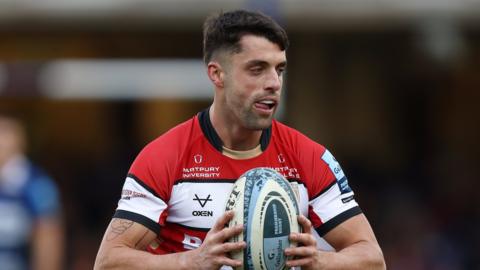 Adam Hastings with the ball for Gloucester