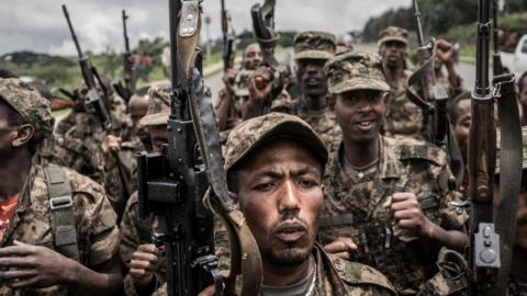 Ethiopian National Defence Forces (ENDF) soldiers shout slogans after finishing their training in the field of Dabat, 70 kilometres northeast of the city of Gondar, Ethiopia, on September 14, 2021