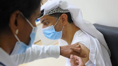 An Emirati man gets vaccinated against the COVID-19 coronavirus at al-Barsha Health Centre in the Gulf Emirate of Dubai on December 24, 2020.