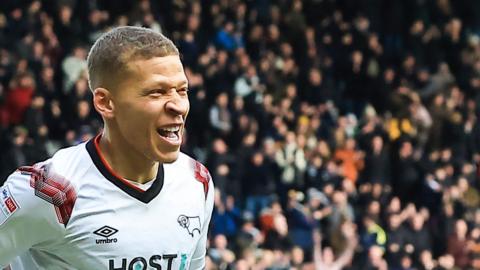 Dwight Gayle celebrates his first goal for Derby County