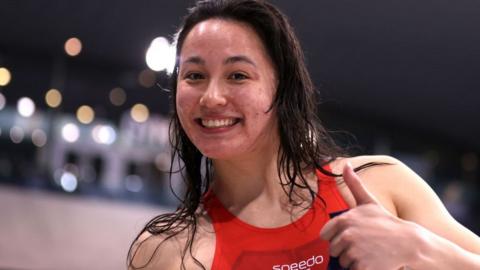 Alice Tai celebrates after winning the para 100m backstroke at the Aquatics GB Swimming Championships