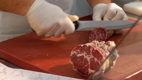 Parma ham being cut