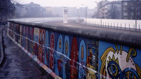 A section of the Berlin Wall covered in graffiti