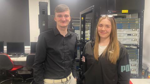 Students Denisa and Fraser pictured in the data department of the University of Gloucestershire