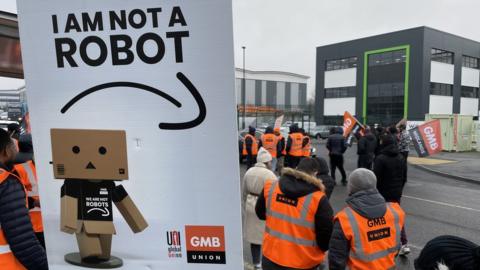 Workers outside Amazon centre