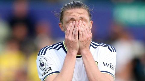 Leeds United's Luke Ayling looks dejected after his team is relegated from the Premier League