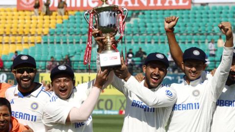 India celebrate with the Test series trophy