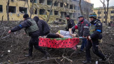 Iryna Kalinina (32), an injured pregnant woman, is carried from a maternity hospital that was damaged during a Russian airstrike in Mariupol, Ukraine, 09 March 2022.