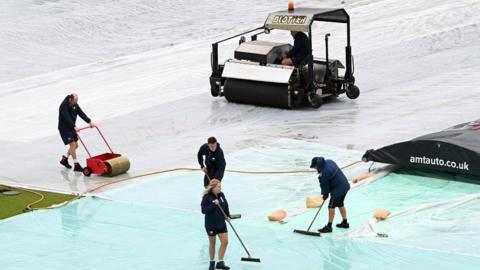 Headingley groundstaff attempt to clear excess water