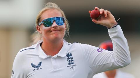 England spinner Sophie Ecclestone holding the match ball after taking five wickets in the Ashes Test v Australia