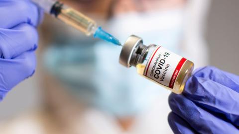 Covid vaccine with syringe