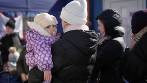 Refugees fleeing Ukraine at a centre in Slovakia, 13 March 2022
