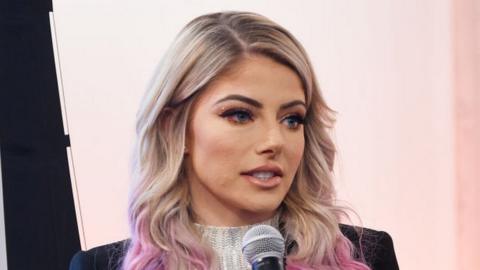 Alexa Bliss speaking at an event