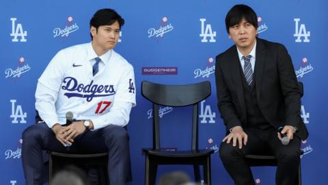 Shohei Ohtani answers questions and Ippei Mizuhara translates during the Los Angeles Dodgers Press Conference.