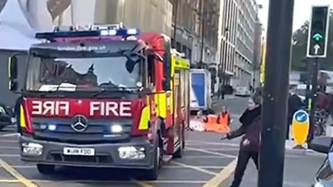 Screengrab of video shared by PA, showing a fire engine and Just Stop Oil