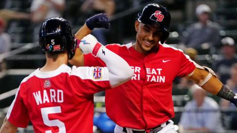 Harry Ford celebrates with team-mate Nick Ward after scoring a home run in Great Britain's win over Colombia at the World Baseball Classic