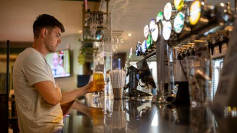 Barman in Wetherspoon pub