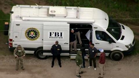 An aerial view shows a Federal Bureau of Investigation (FBI) van where a search is being conducted for Francisco Oropeza, 38,