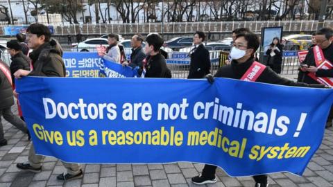 South Korean doctors protest against the government's medical policy in front of the Presidential office in Seoul
