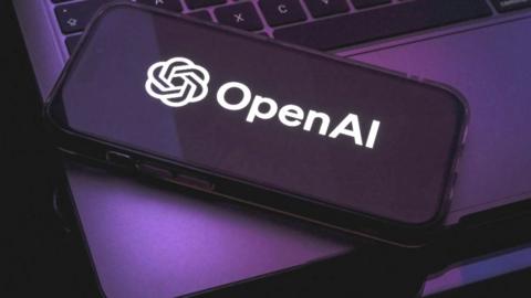 The OPenAI logo on a laptop