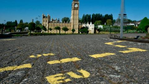 Ground markings are seen at the mock border of the United Kingdom and the European Union during the reopening of the 'Mini-Europe'