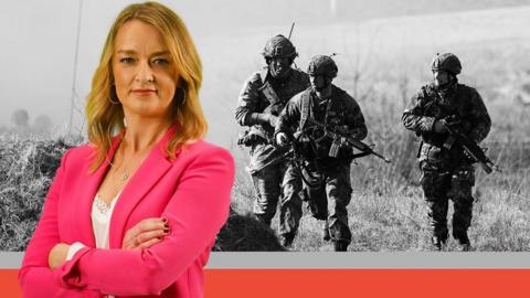 Laura Kuenssberg in front of a shot of three Nato soldiers on exercises