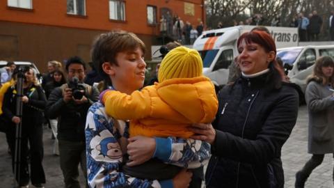 A mother is reunited with her son in Kyiv in March 2023