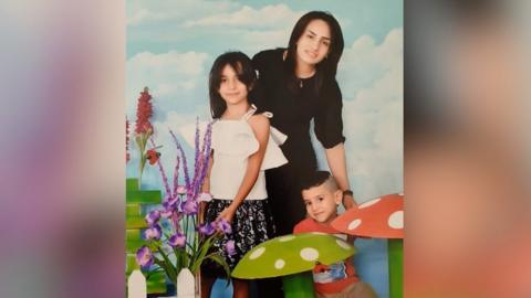 Inas Alali and her children
