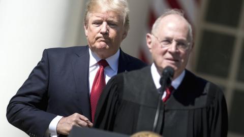 US President Donald Trump (L) listens while Supreme Court Justice Anthony Kennedy speaks during a ceremony in the Rose Garden of the White House in Washington DC, 10 April 2017