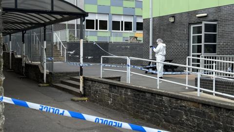 Forensic officers at the school