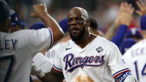 Adolis Garcia celebrates his walk-off home run for the Texas Rangers